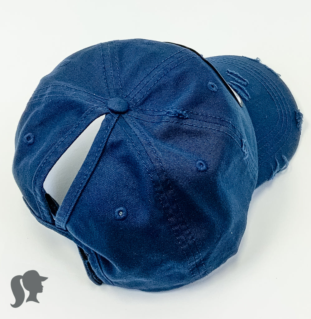 navy solid ponytail hat with barbells and ponytails text