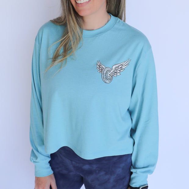 blue long sleeve crop tee with wing design