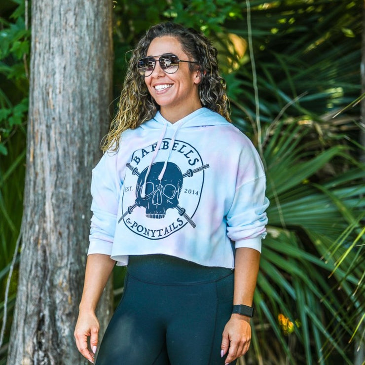 cotton candy tie-dye crop hoodie with grey skulls and barbells design