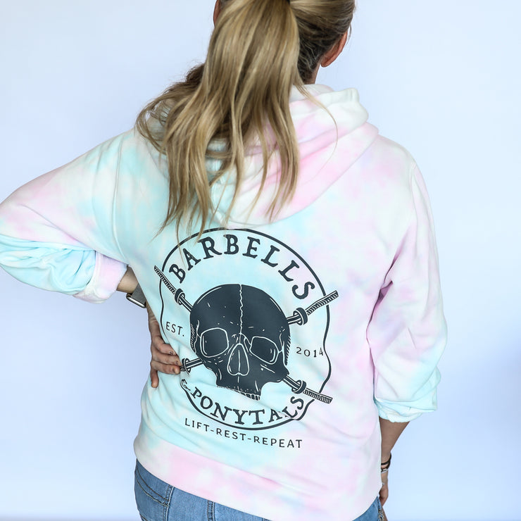 cotton candy tie-dye pullover hoodie with grey skulls and barbells design