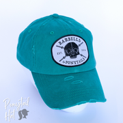 solid aqua ponytail hat with skulls and barbells text