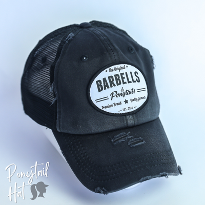 black mesh ponytail hat with barbells and ponytails text