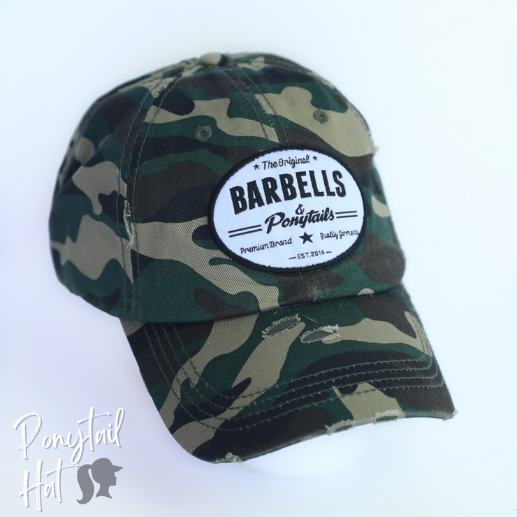 solid green camo ponytail hat with barbells and ponytails text