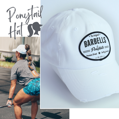 solid white ponytail hat with barbells and ponytails text