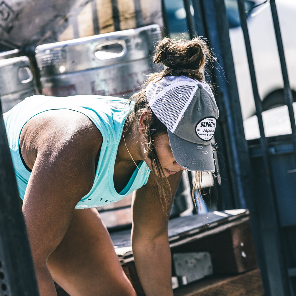 grey and white mesh ponytail hat with barbells and ponytails text