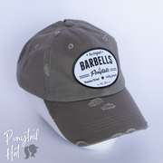 solid light grey ponytail hat with barbells and ponytails text