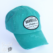 solid aqua ponytail hat with barbells and ponytails text