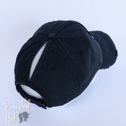solid black ponytail hat with barbells and ponytails text