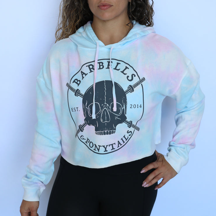 cotton candy tie-dye crop hoodie with grey skulls and barbells design